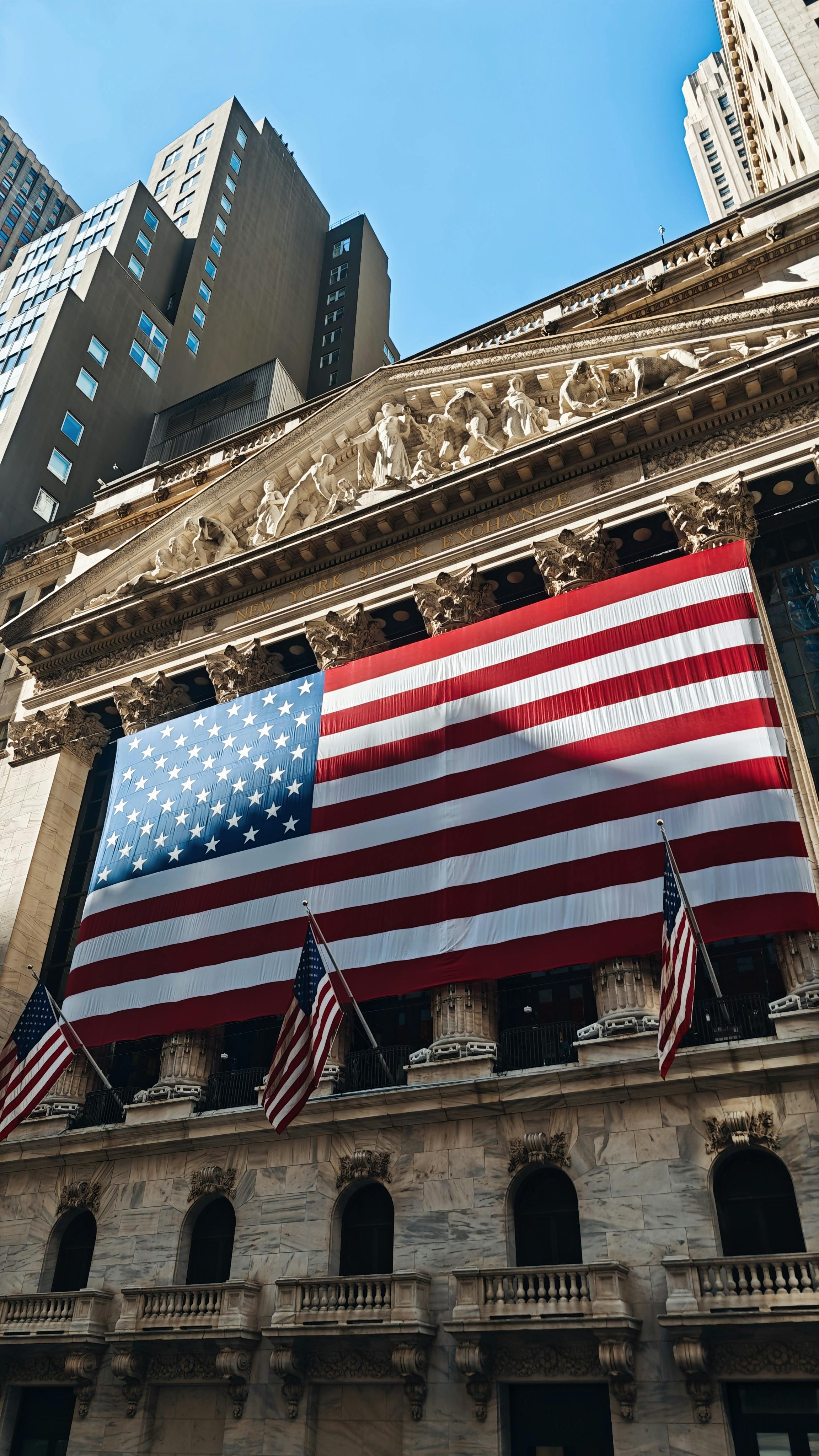 New York Stock Exchange facade with large American flag